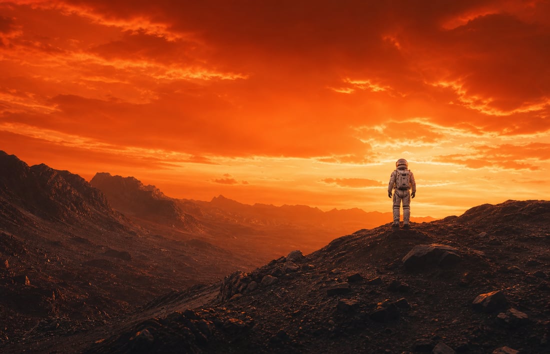 A lone figure on a ridge at twilight